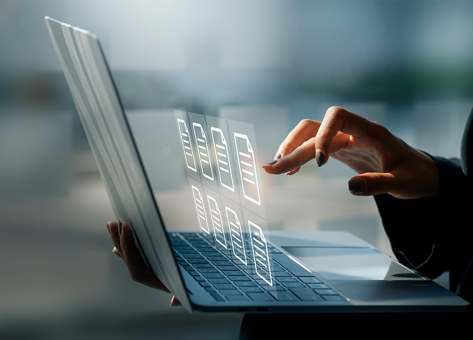 Digital Filing Cabinet: Close up of person typing on laptop