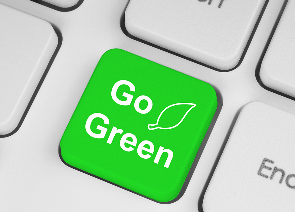 Close up of keyboard buttons. The center button is green and has the words "Go Green" on it. 