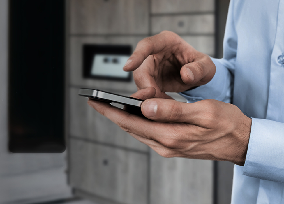 Person using phone to unlock Exela's smart locker systems